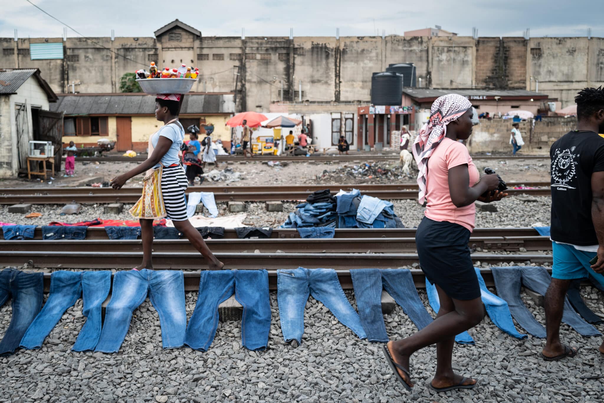 Dyed Jeans oin train tracks near Kantamanto Market